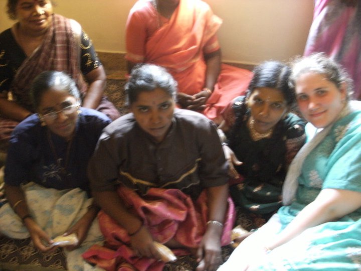 Anne Marie sitting on the floor among women at a home for the physically disabled in India